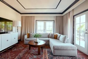 a living room with a couch and a table at The Oliver, Oxford in Oxford