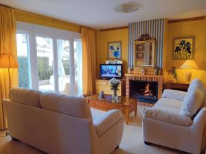 TV a/nebo společenská místnost v ubytování Chalet AIRAM