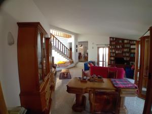 a living room with a couch and a table at Carachouse Pellaro in Pellaro