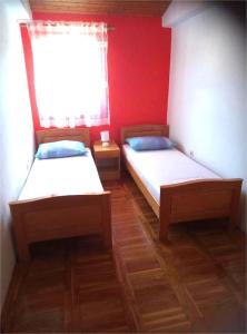 Postel nebo postele na pokoji v ubytování Apartments Dalmatia