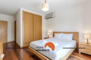 Ένα ή περισσότερα κρεβάτια σε δωμάτιο στο #327 Corcovada 43 Vista Piscina by Home Holidays +44 φωτογραφίες