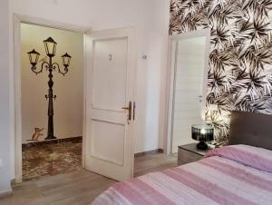 Postel nebo postele na pokoji v ubytování FalcoBianco GuestHouse
