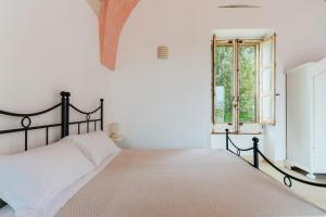 Katil atau katil-katil dalam bilik di Tenuta Manchi Rooms - Salento Selection +54 gambar