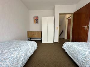 Ένα ή περισσότερα κρεβάτια σε δωμάτιο στο Apartment Ruhepause III Ruhig & Geräumig