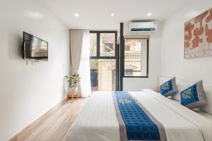 Ένα ή περισσότερα κρεβάτια σε δωμάτιο στο Thùy Dung Hotel & Apartment Mễ Trì +34 φωτογραφίες