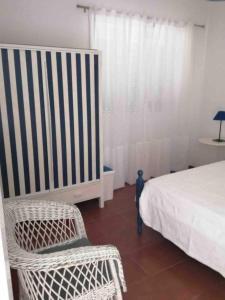 Ένα ή περισσότερα κρεβάτια σε δωμάτιο στο GuestReady - Cheerful Ponta Delgada townhouse