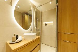 a bathroom with a sink and a mirror at Apartment Puntamica in Zadar +19 photos