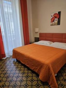 Postel nebo postele na pokoji v ubytování HOTEL ETNEA ROYAL SUITEs
