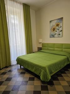 Postel nebo postele na pokoji v ubytování HOTEL ETNEA ROYAL SUITEs