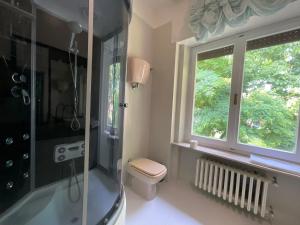 a bathroom with a shower and a toilet and a window at Oasi Venus Perugia e Assisi in Ponte San Giovanni +30 photos