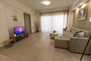 TV a/nebo společenská místnost v ubytování Nelly's Modern House