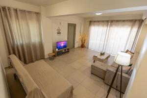 TV a/nebo společenská místnost v ubytování Nelly's Modern House