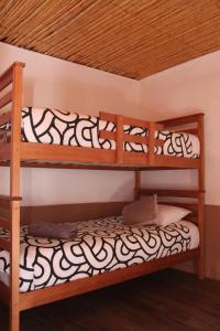 a bedroom with two bunk beds in a room at Vientos - La Yareta in San Pedro de Atacama +43 photos