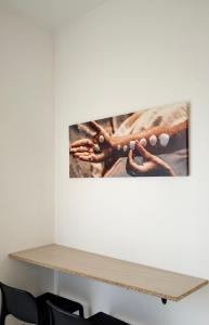 a shelf in an office with a picture on the wall at Kolossoi Guest House in Càbras