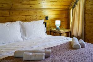 Postel nebo postele na pokoji v ubytování Tuta Area Cottage