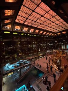 a large building with people walking around a pool at Bords de Marne Charmant Appart in Thorigny-sur-Marne