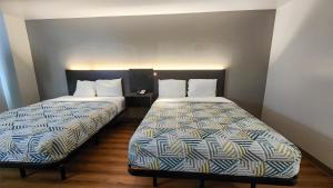 Postel nebo postele na pokoji v ubytování Motel 6-Ennis, TX