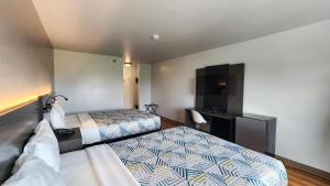 Postel nebo postele na pokoji v ubytování Motel 6-Ennis, TX