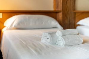 A bed or beds in a room at Locanda Al Cacciatore