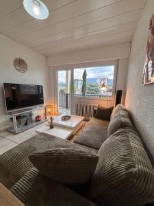 Posezení v ubytování Le Central parking et 15 minutes à pied du lac