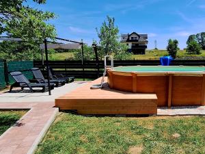 a pool table in a yard with a pool table at Apartment Nina-bazen-klima-parking in Otočac