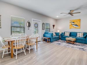a living room with a blue couch and a table at Nauta Mirage in Rockport