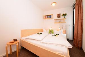 Posteľ alebo postele v izbe v ubytovaní Familienhotel Kleinwalsertal