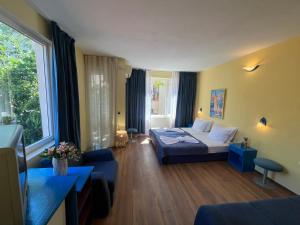Postel nebo postele na pokoji v ubytování Hotel NEMO