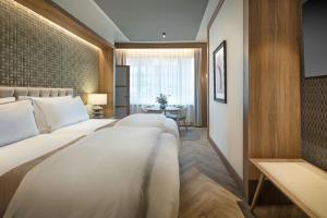 Postel nebo postele na pokoji v ubytování The Westin Madrid Cuzco