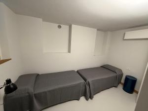 a room with a bed in the corner of a room at Alessandra House in Grottammare +4 photos