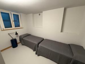 a bedroom with a bed and a suitcase in it at Alessandra House in Grottammare