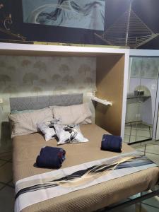 a bed with two bags on top of it at A casa di ninni ''Ormea room'' in Turin +12 photos