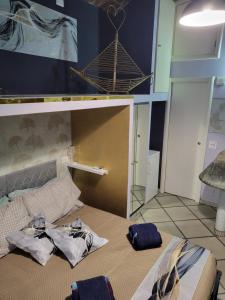 a bedroom with a bed with two bags on it at A casa di ninni ''Ormea room'' in Turin