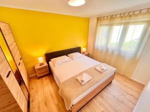 Postel nebo postele na pokoji v ubytování Apartments Gorana