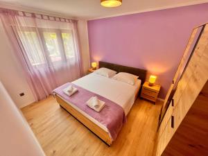 Postel nebo postele na pokoji v ubytování Apartments Gorana