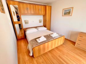 Postel nebo postele na pokoji v ubytování Apartments Gorana