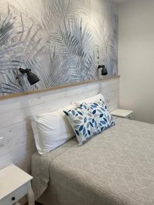 Postel nebo postele na pokoji v ubytování Catalogna10 Rooms