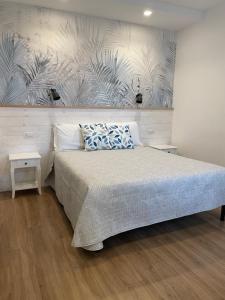 Voodi või voodid majutusasutuse Catalogna10 Rooms toas