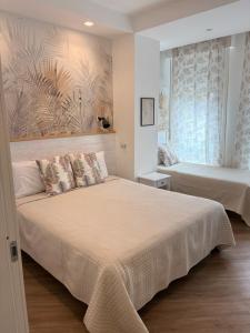 Voodi või voodid majutusasutuse Catalogna10 Rooms toas