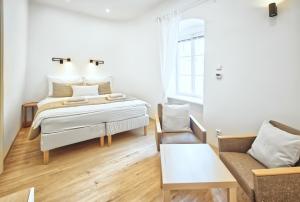Posteľ alebo postele v izbe v ubytovaní Apartmány VIENNA