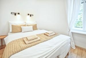 Posteľ alebo postele v izbe v ubytovaní Apartmány VIENNA