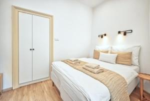 Posteľ alebo postele v izbe v ubytovaní Apartmány VIENNA