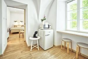 Posteľ alebo postele v izbe v ubytovaní Apartmány VIENNA