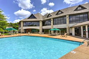 a large swimming pool in front of a building at Pool and Lake Access Cozy Nest in Branson West in Branson West