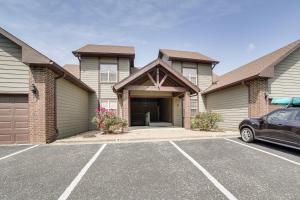 a house with a car parked in a parking lot at Pool and Lake Access Cozy Nest in Branson West in Branson West
