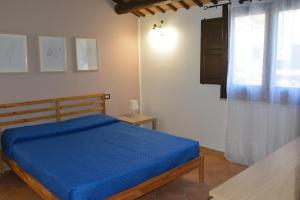 En eller flere senge i et værelse på Appartamento Casa Magnolia