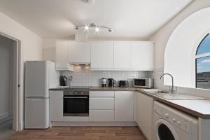 Nhà bếp/bếp nhỏ tại Modern town centre apartment