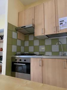 Kuchyň nebo kuchyňský kout v ubytování Glicine House
