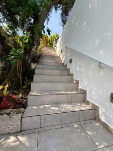 a set of stairs leading up to a building at Alexander studio in Spartià