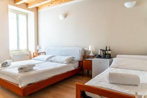Postel nebo postele na pokoji v ubytování B&B San Rocco